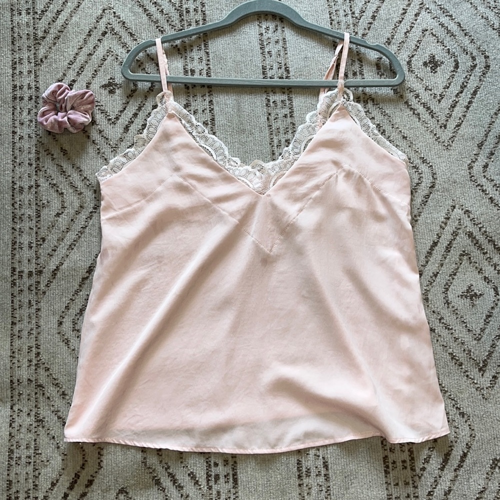 No tags bought from boutique. Silk light pink lace-trimmed top.